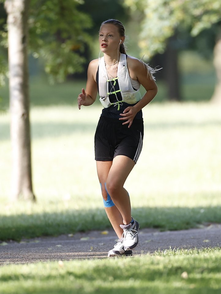  A woman jogs on The Mall in central London on Wednesday morning