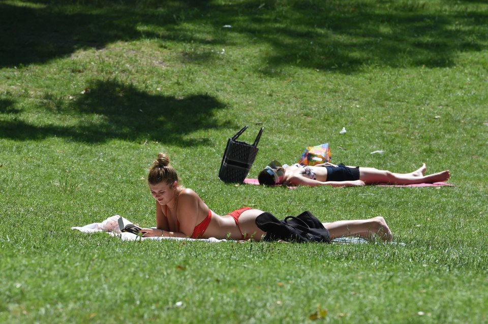  Londoners bask in the sun at Battersea Park on Wednesday