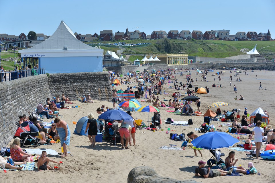 Sunseekers enjoyed the beautiful weather on Barry Island, Wales