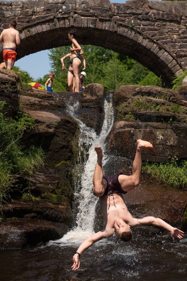  A swimmer backflips into the River Dane by Three Shires Head