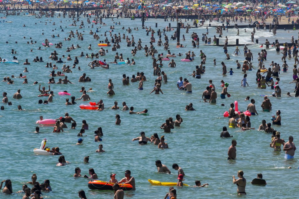 The beach at Bournemouth is packed with visitors