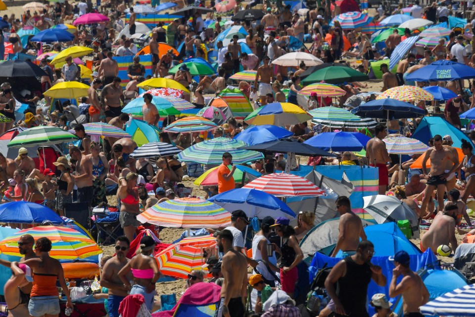  Umbrellas fill the beach in Bournemouth