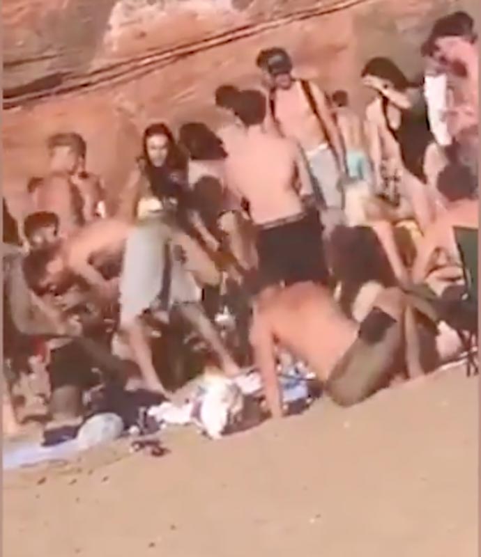 A beach brawl of up to 200 sunbathers erupted yesterday at Orcombe Point, Devon