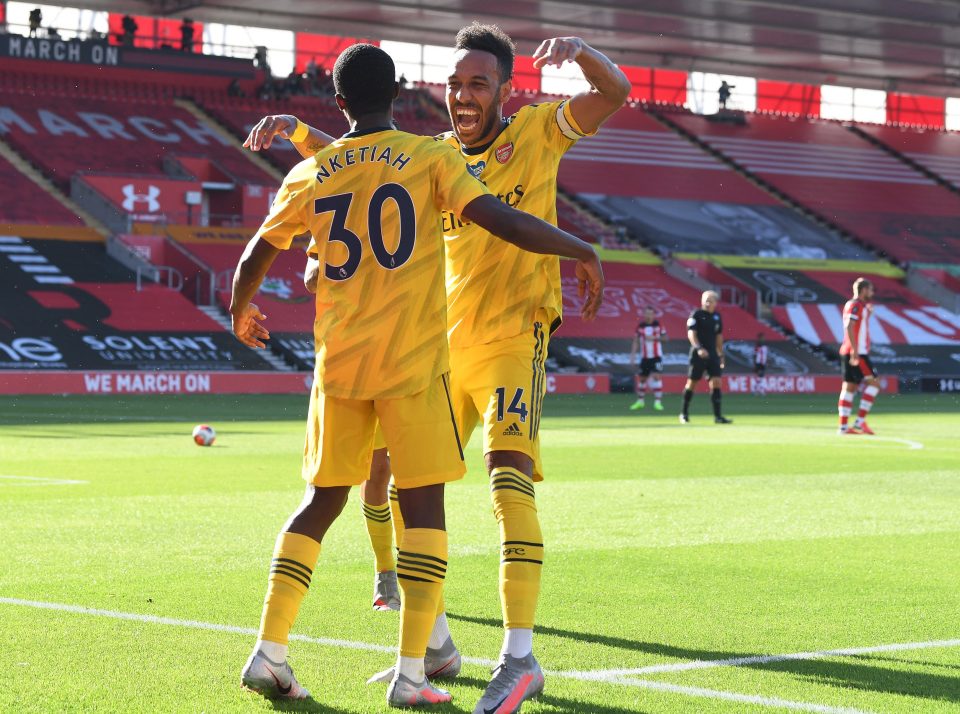  The forward celebrates with strike partner Aubameyang