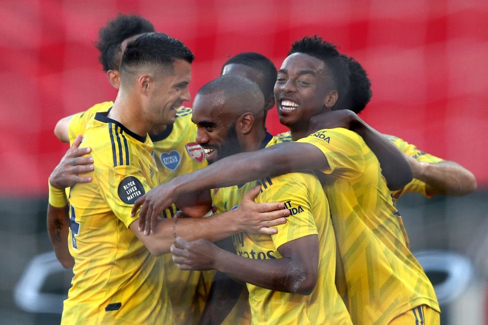  Arsenal celebrate their third away win of the season