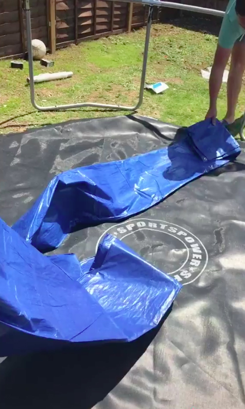  A huge, durable tarpaulin holds the water together, while black shrink wrap keeps it warm