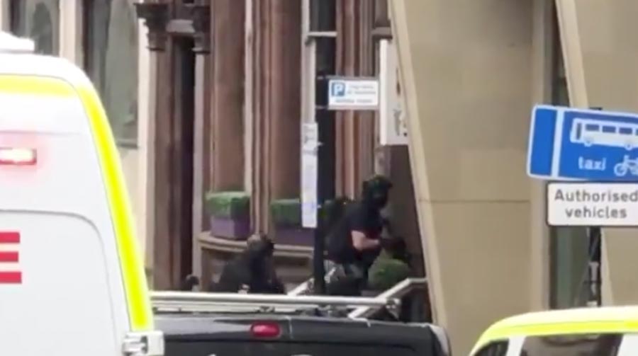 Armed cops stormed a hotel in the city centre today