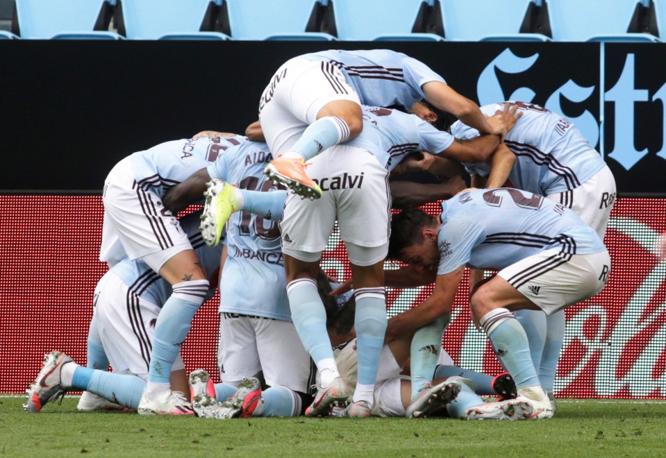  The former Liverpool man is then mobbed by his jubilant team-mates