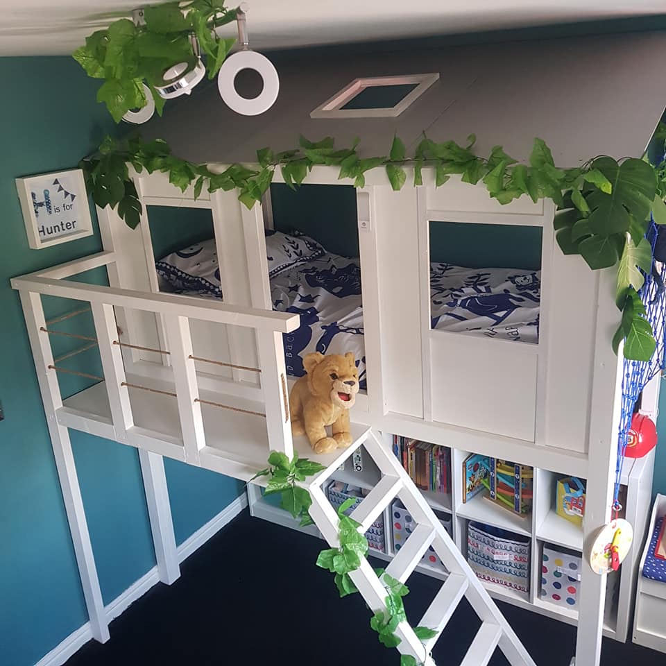 A dad created a treehouse-themed bed for his son complete with a balcony and skylights