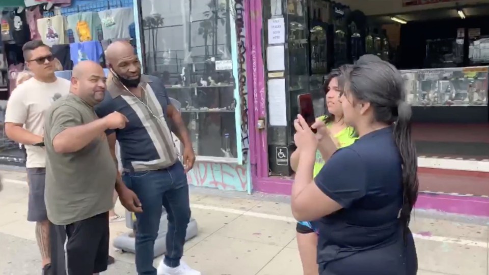 Mike Tyson rolled down his mask to take photos with fans