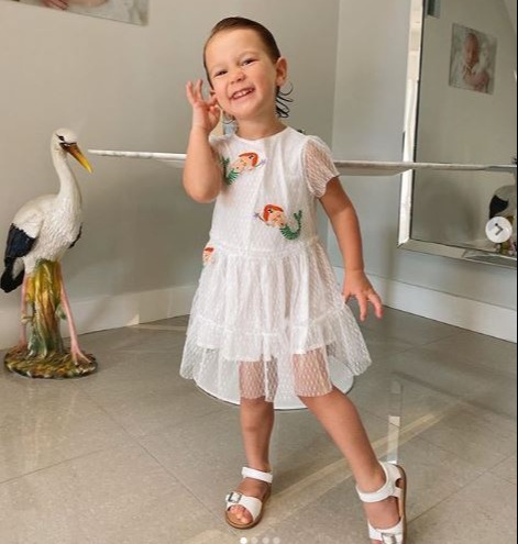 Rosie looks adorable in this sweet £130 Stella McCartney frock which she paired with some bargain Asda sandals