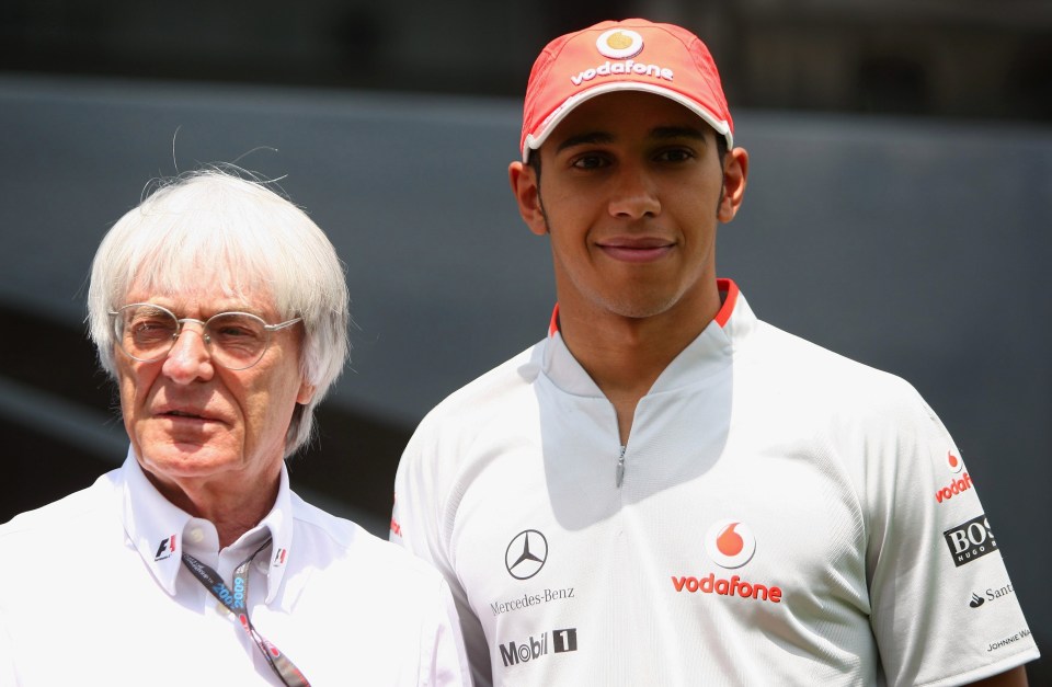 Bernie Ecclestone poses with Lewis Hamilton in 2009 in Barcelona