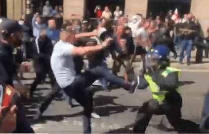 A crowd of protesters countering the BLM group surged towards a line of cops marching away from them and attacked