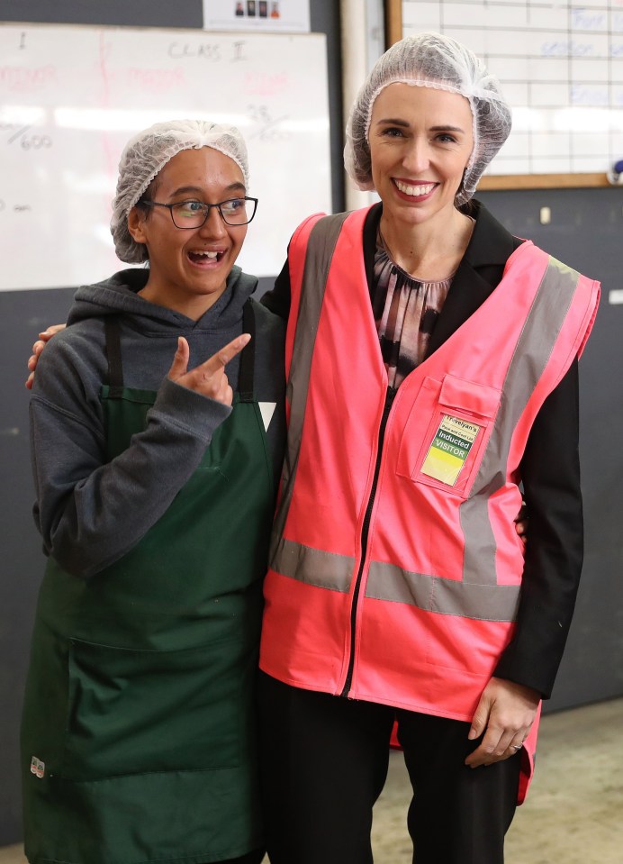 PM Jacinda Ardern, right, meeting staff at Trevelyans Kiwifruit and Avocado Packhouse on June 9, in Tauranga after NZ'sCovid-19 restrictions were lifted