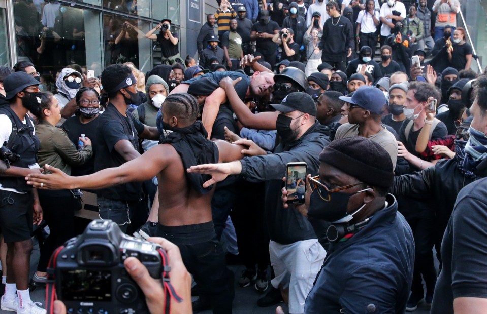 Other BLM protesters appeared to be making a path to get the injured man through