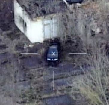 Aerial footage of a car in an overgrown area shown on 60 Minutes