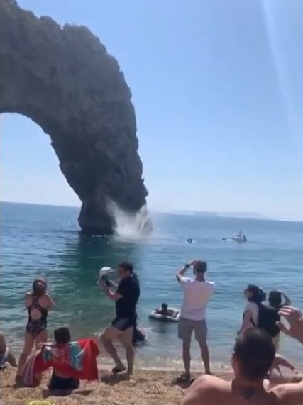 Crowds cheered as the man crashed into the water below