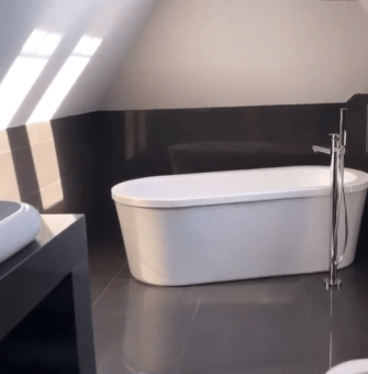  Her sleek en-suite features a stand alone bathtub and and gleaming floors