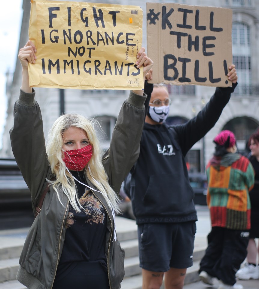 Activists in London protest the new immigration bill the government has prepared, June 29