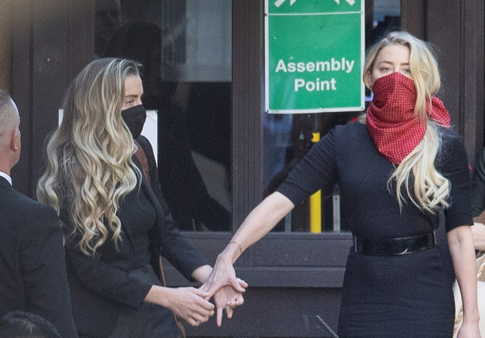 Amber Heard is seen here outside court being supported by her sister Whitney