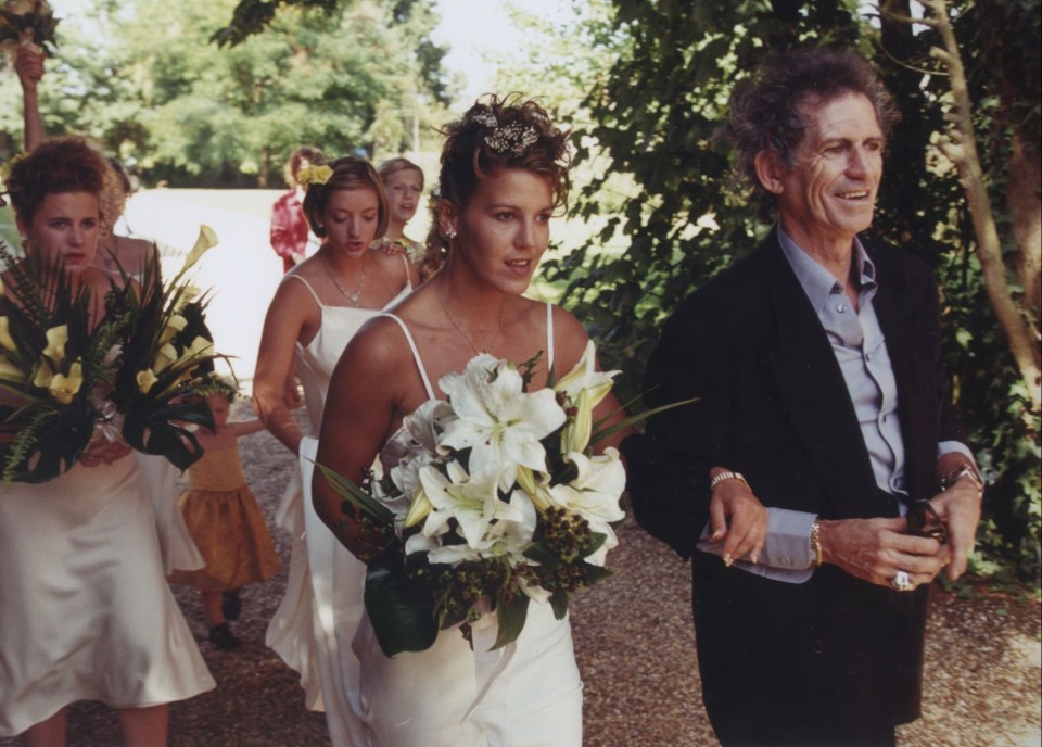 The rocker is pictured here at the lavish £250,000 wedding in 1998