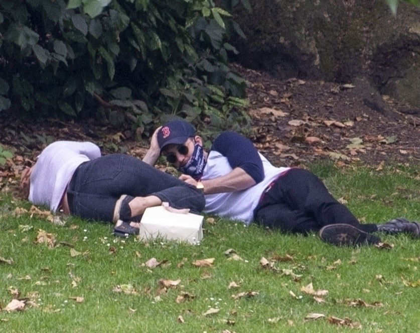 The pair were seen lying side by side in the park yesterday