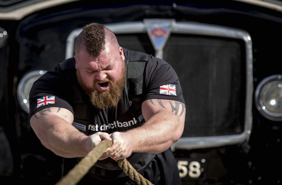 Eddie Hall pulls a bus weighing eight and a half tonnes on the first day of 'Giants Live Europe' Strongest Man competition in 2017