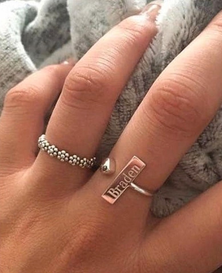 A bride-to-be showed off her engagement ring which was stamped with her fiance's name