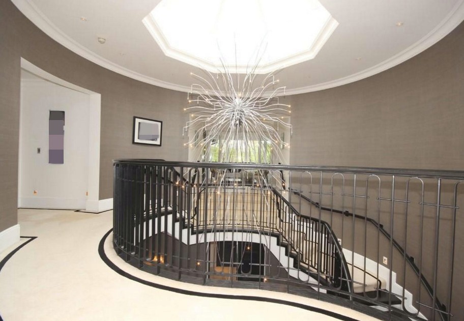 The stunning skylight shows off the elaborate staircase beautifully