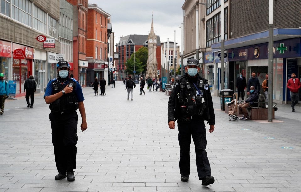 Two police officers in Leicester as the city went into lockdown