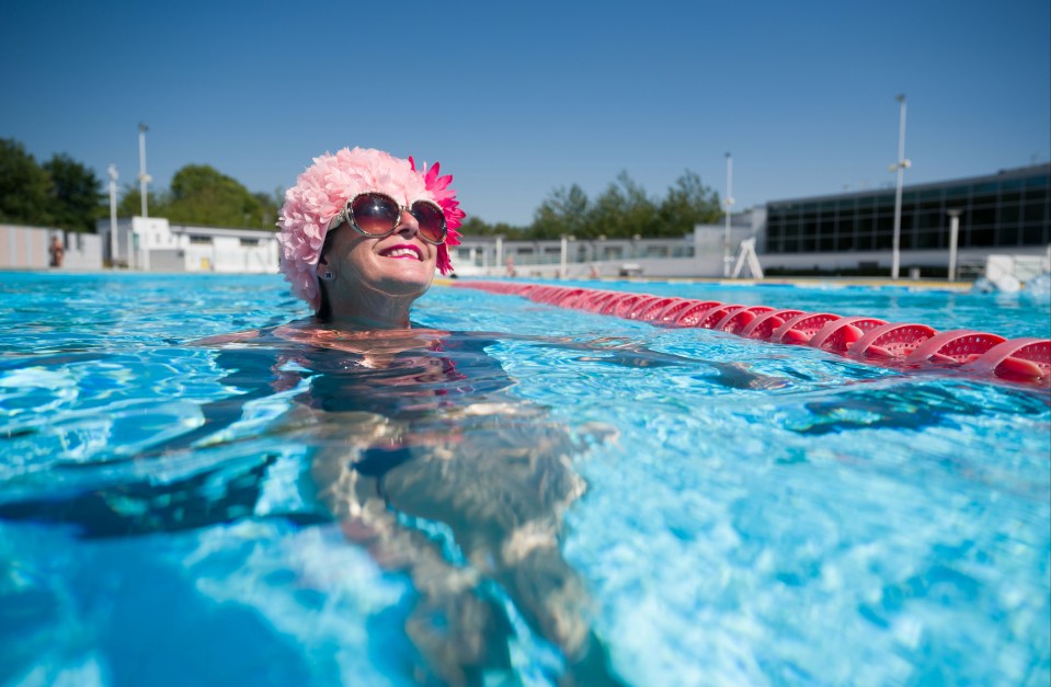 A swimmer soaks up the rays at one of London's outside pools