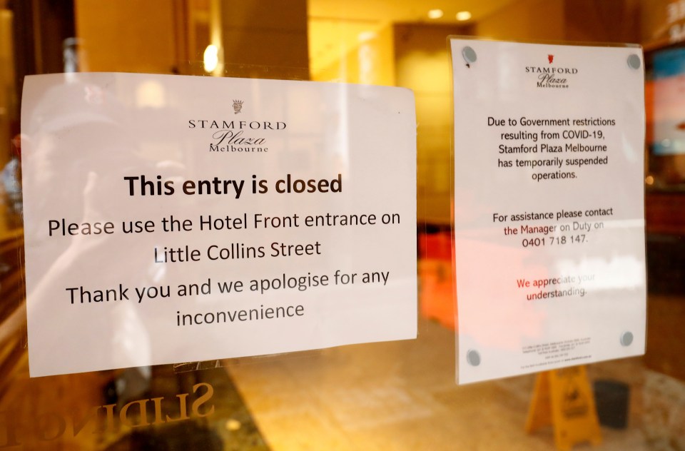 Signs are seen in the windows of the Stamford Hotel in Melbourne