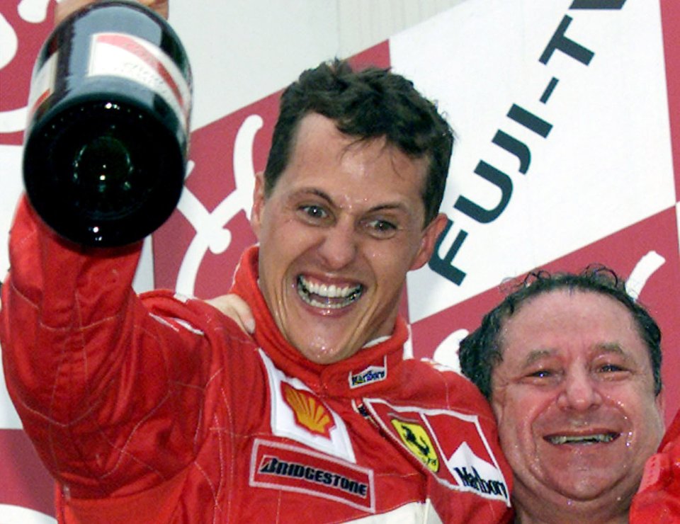 Michael Schumacher with former Ferrari Motor Sport team manager Jean Todt after winning the Formula One Japanese Grand Prix in 2000