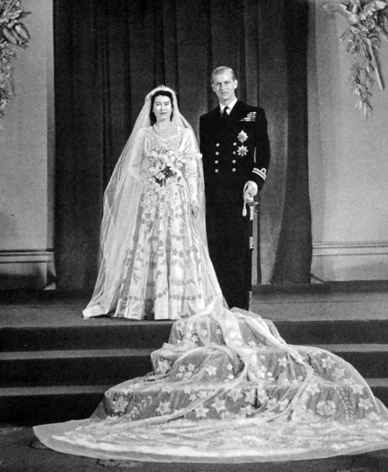 The Queen’s dress was made from ivory silk and featuring a 13-foot train