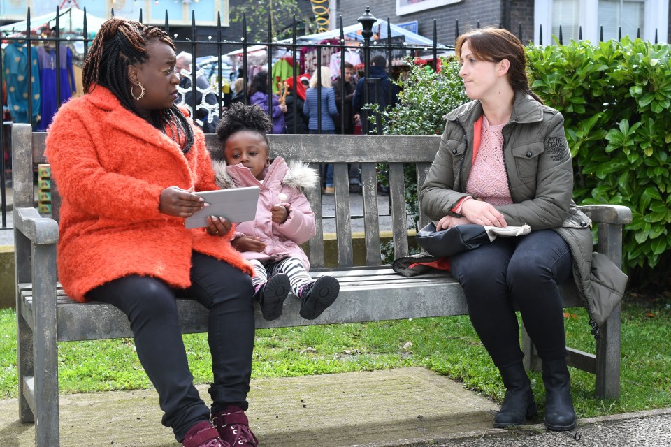 The star on EastEnders as Kim Fox sitting in the Square with Sonia Fowler