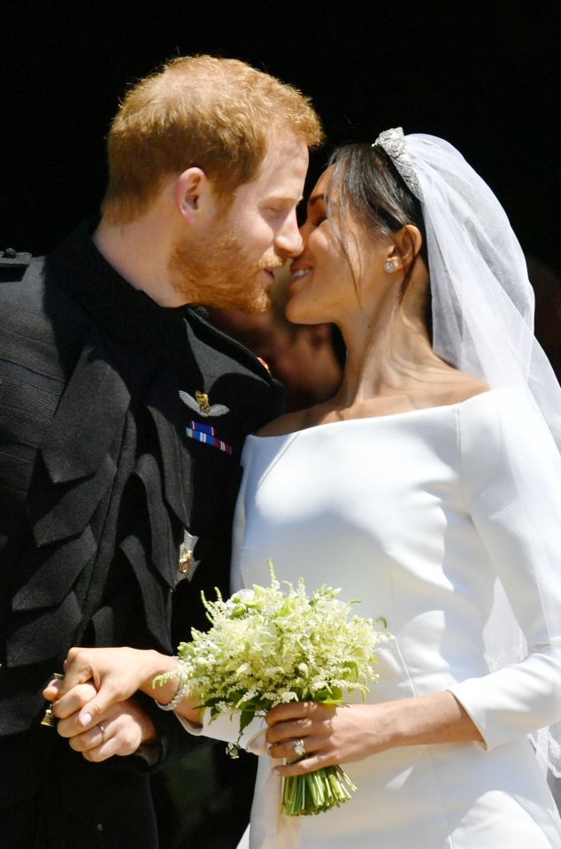 Sharing a kiss as a newly married couple at Windsor Castle