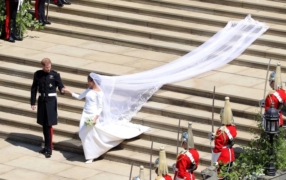 It had a 16ft train and veil which was adorned with the flowers of the 53 commonwealth countries