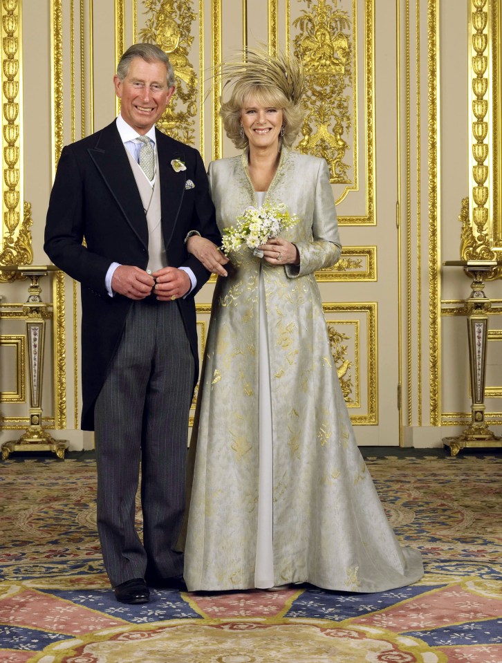 Camilla wore a pale blue oyster silk coat with gold detailing by Robinson Valentine