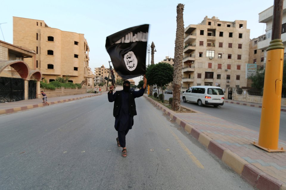 Samia was injured while living in Raqqa under ISIS rule. An extremists is pictured in the Syrian city in 2014