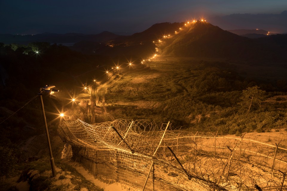 North Korea's borders can be extremely dangerous to cross - this fence divides the Korean Demilitarized Zone separating North and South Korea