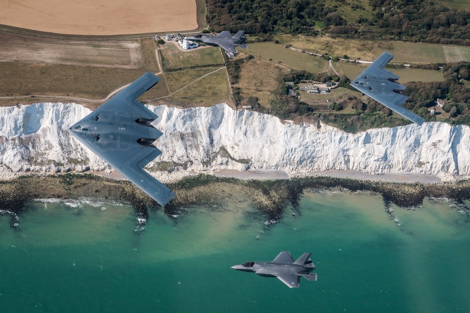 The B-21 is the followup to the angular B-2 stealth bomber (left and right) flown by the Air Force since 1989