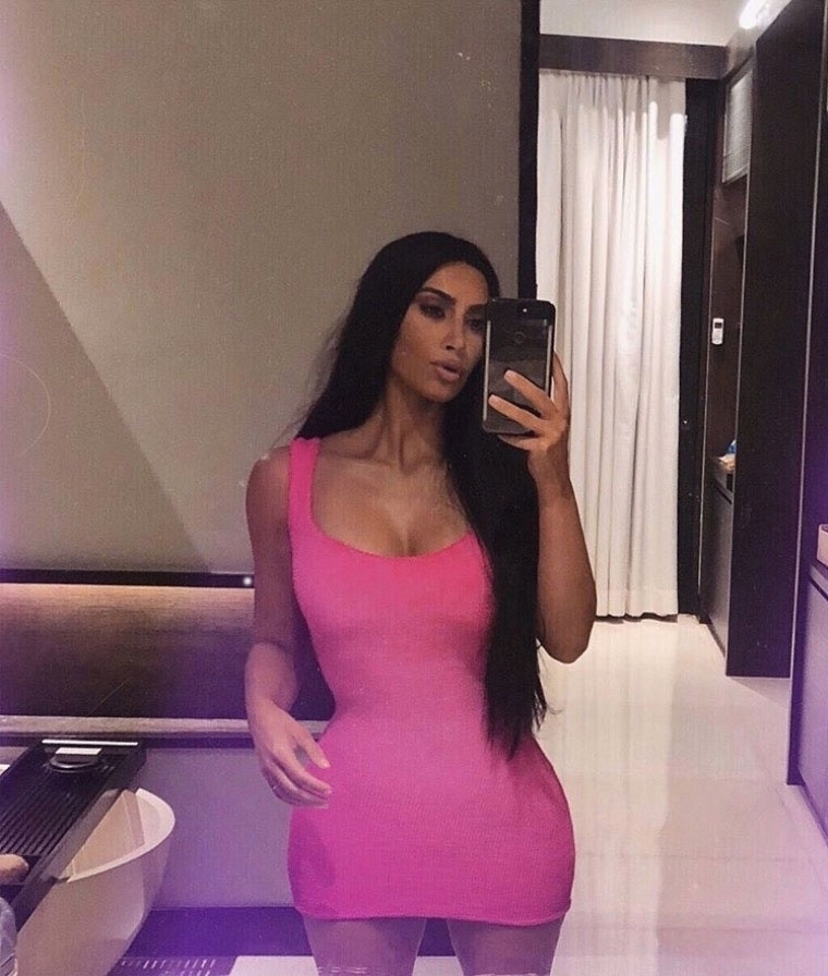 Kim K flaunted her curves in a bright pink bodycon