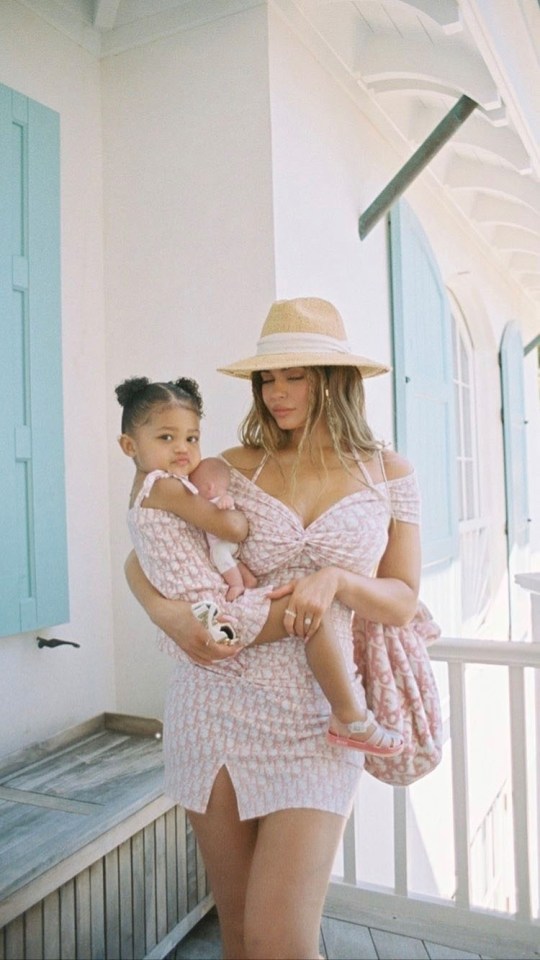 Kylie Jenner proves she's all over the new trend as she poses for a snap with her daughter Stormi