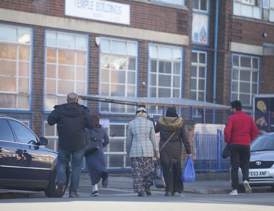 Workers arrive at textile manufacturing factories in Leicester