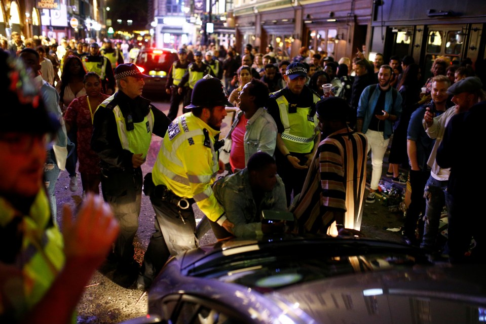 Police on patrol as people gather in Soho, as Covid-19 restrictions are eased