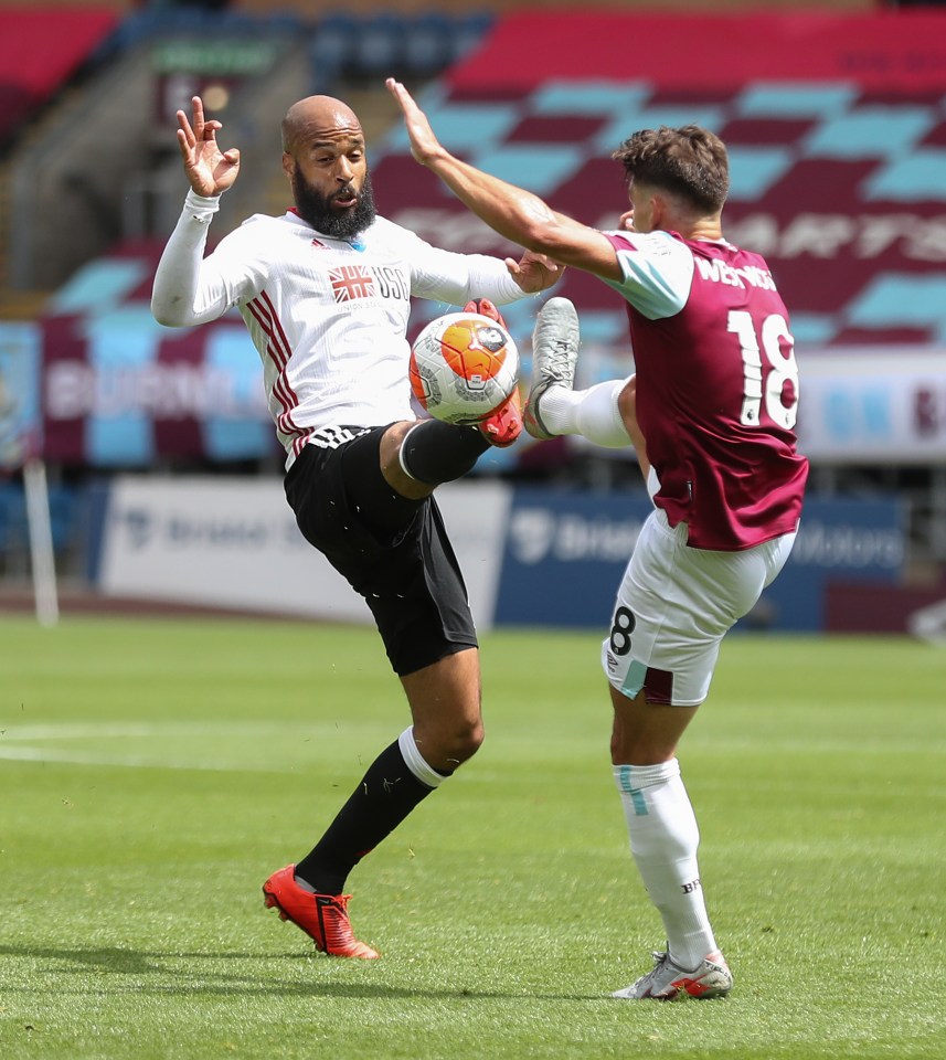 David McGoldrick and Ashley Westwood fight for possession