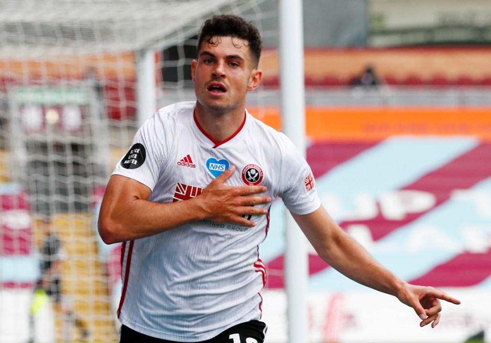 John Egan celebrates his vital equaliser at Turf Moor