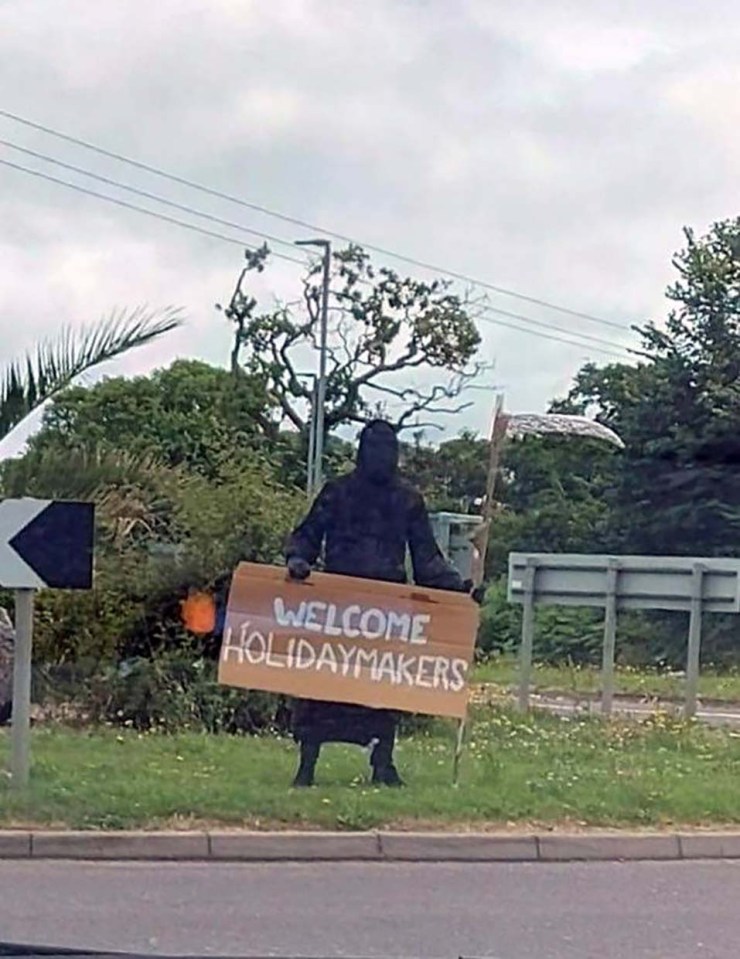 In Devon, tourists arriving in Dawlish  were greeted by a man dressed as the Grim Reaper