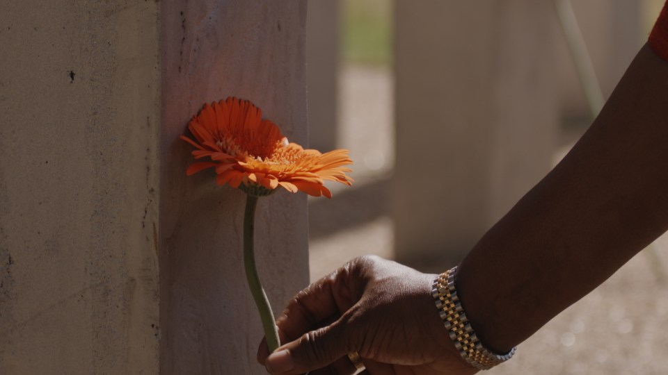  A flower is laid at the memorial to mark the 15th anniversary