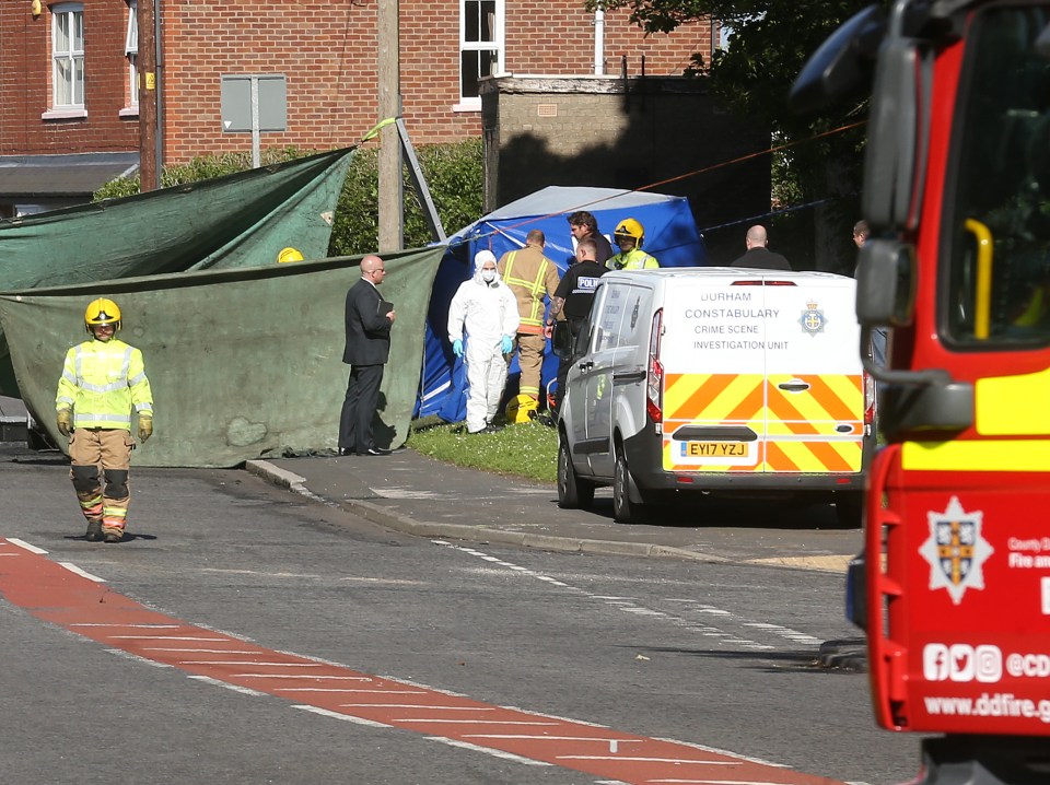 Covers were put around the car as forensic experts investigated